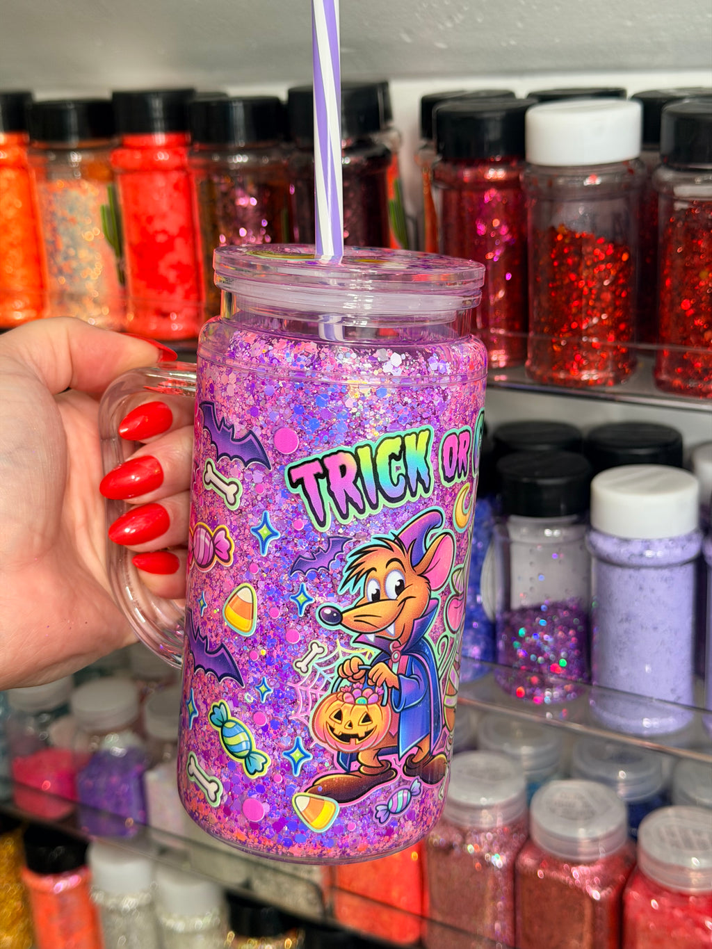 Purple glitter snow globe tumbler with handle and straw, Trick or Cheese cartoon graphic