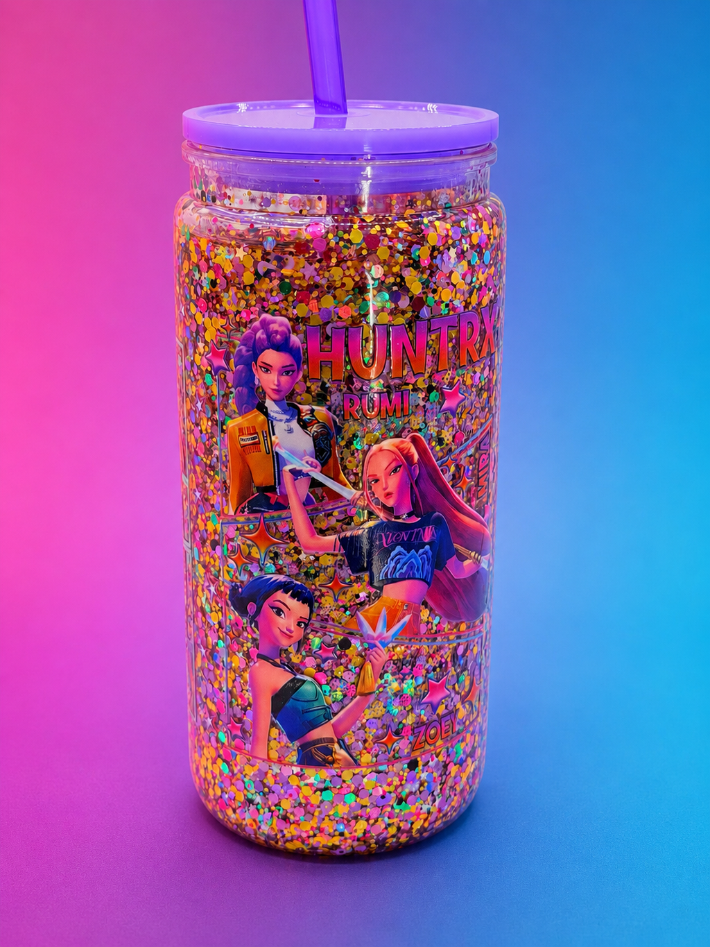 Glitter-filled acrylic snow globe cup with character graphics, purple lid, and straw
