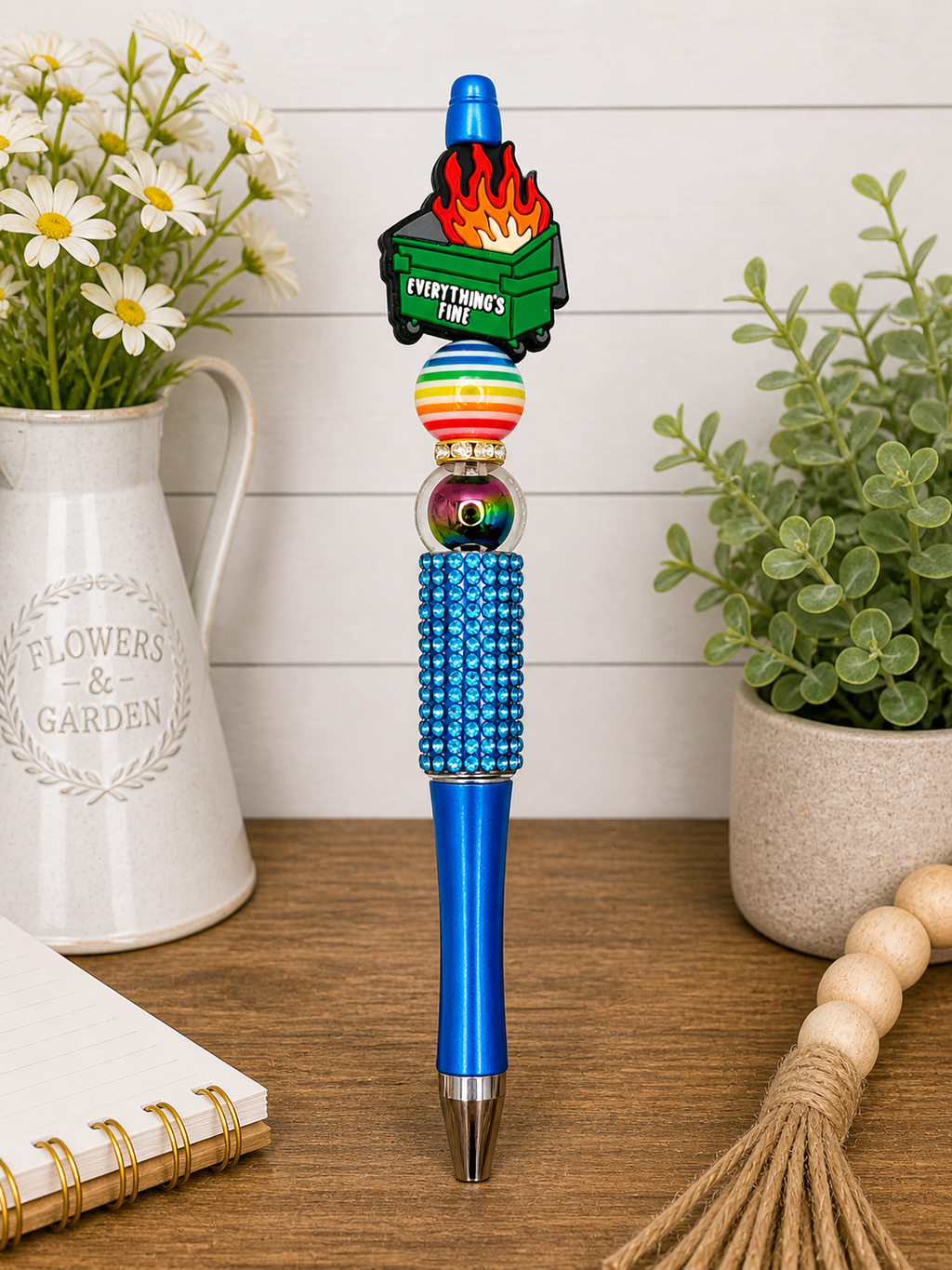 Decorative blue pen with beaded rhinestone grip and flame topper with 'Everything’s Fine'.