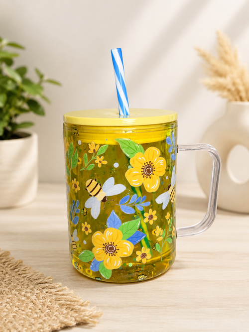 Green acrylic tumbler-style mug with bee and floral design, clear handle and straw
