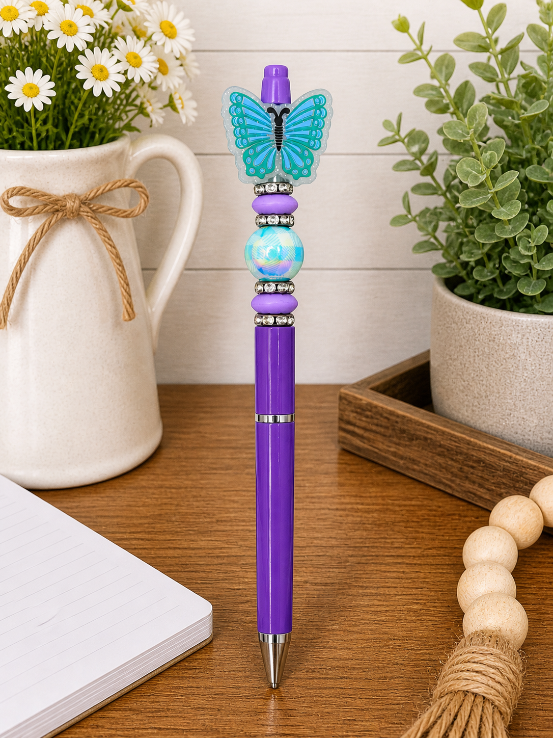 Purple butterfly pen with turquoise butterfly top and blue bead center