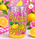 Acrylic lemon mason jar with yellow glitter, colorful lemon pattern, and pink straw.