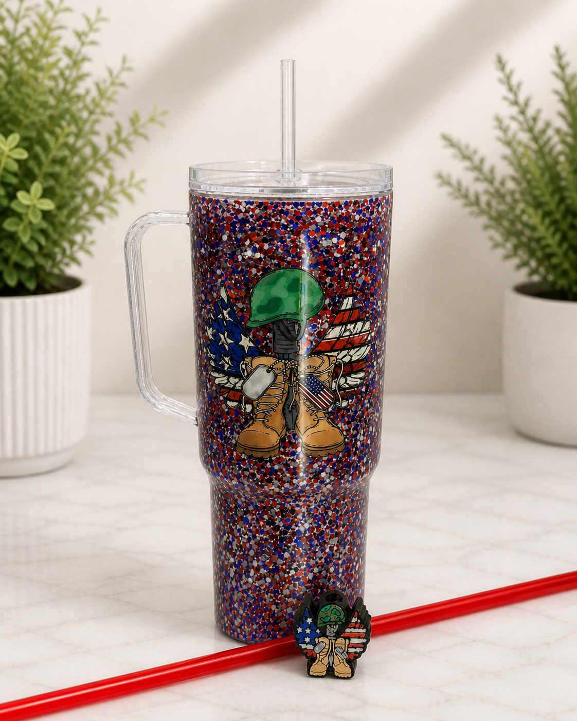 Glitter tumbler cup with straw, red handle, and patriotic boot cartoon graphic