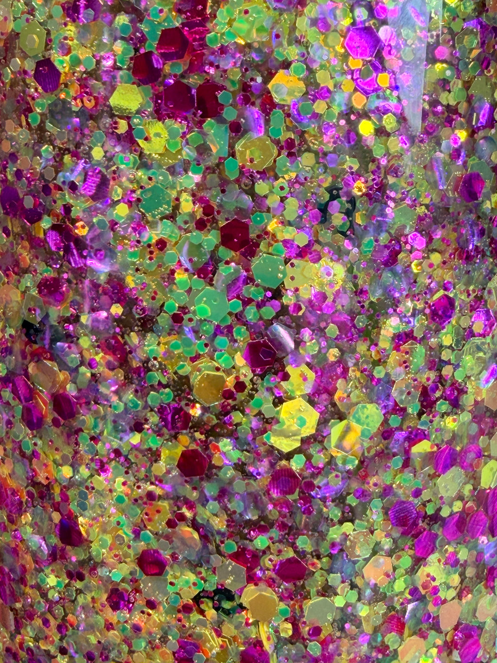 Acrylic snow globe tumbler glitter close-up with multicolor confetti filling