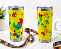 Stainless steel insulated tumbler with colorful autism puzzle pattern graphic, blue lid
