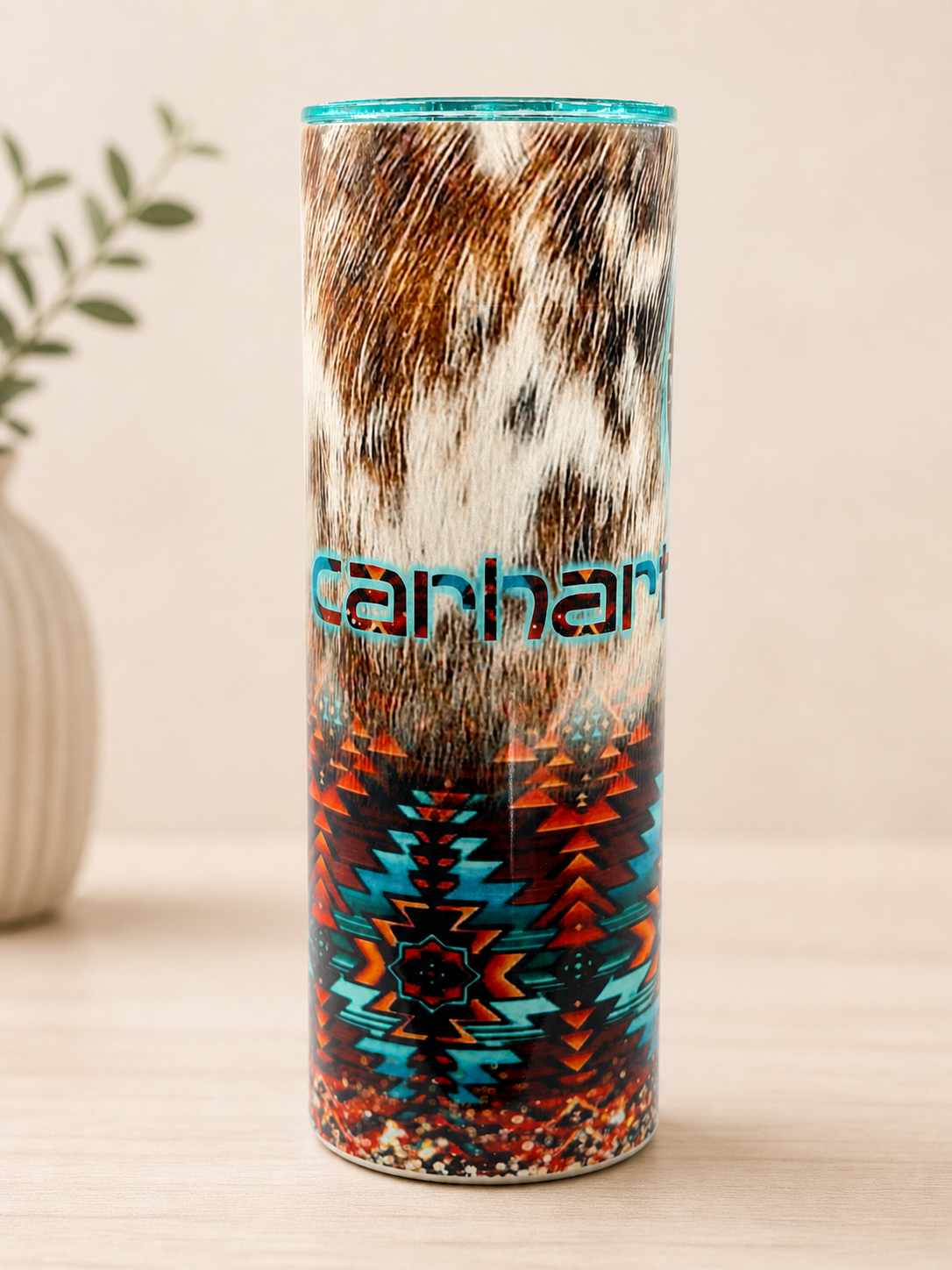 Western-style stainless steel cup with turquoise rim and teal geometric pattern