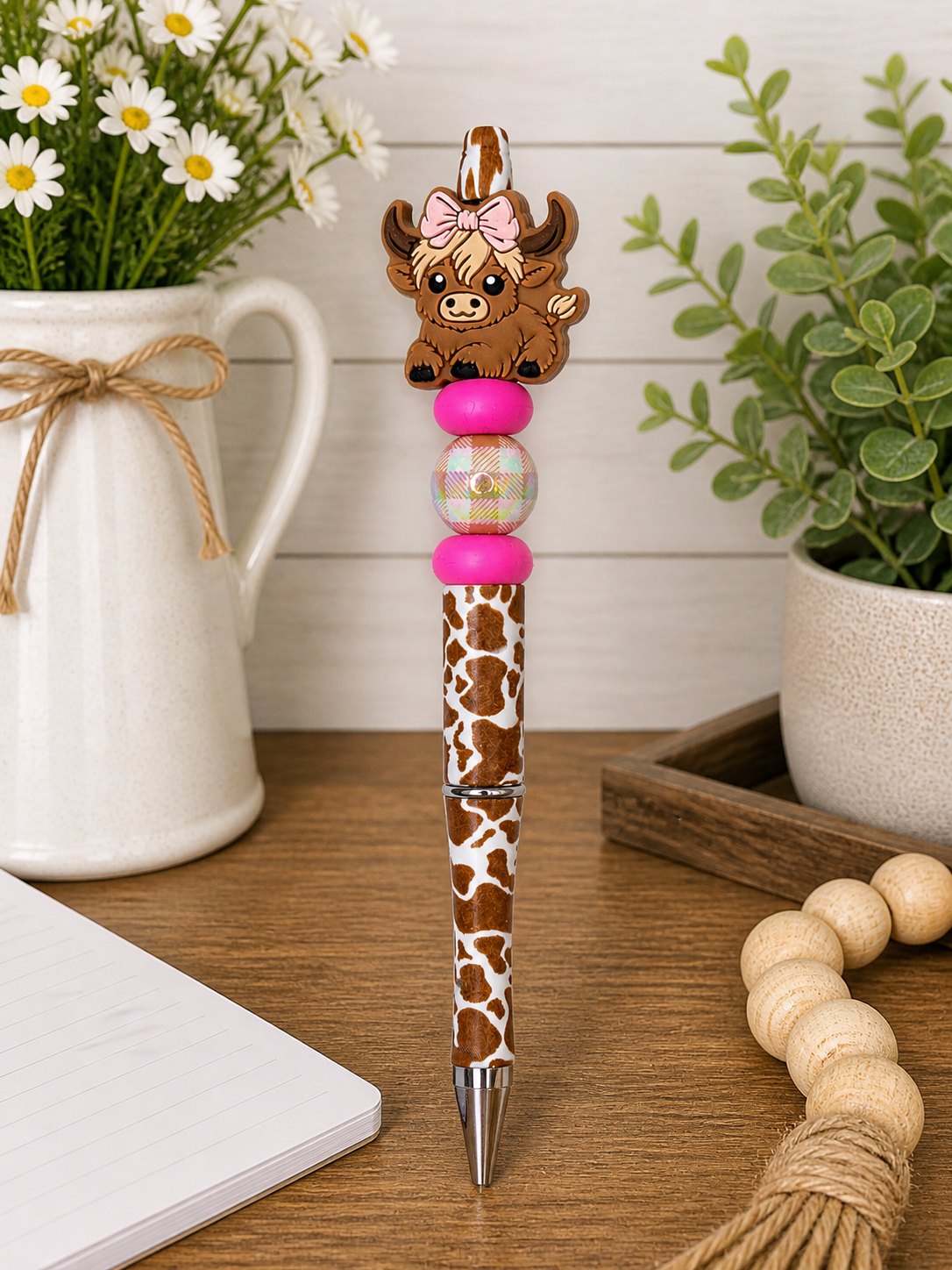 Novelty cow pen with pink bow and pink beaded cap; brown giraffe-spotted grip