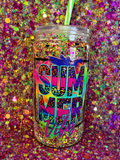 Acrylic snow globe tumbler showing SUMMER Vibes text, clear lid and green straw