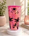 Glitter acrylic snow globe tumbler on base, pink glitter with black palm tree silhouettes