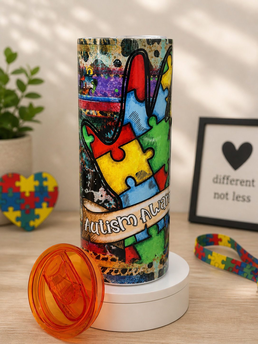 Stainless steel autism awareness cup with colorful puzzle art and 'Autism Always' text