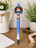 Blue ballpoint pen with circular Fowl Language logo and clear glitter barrel