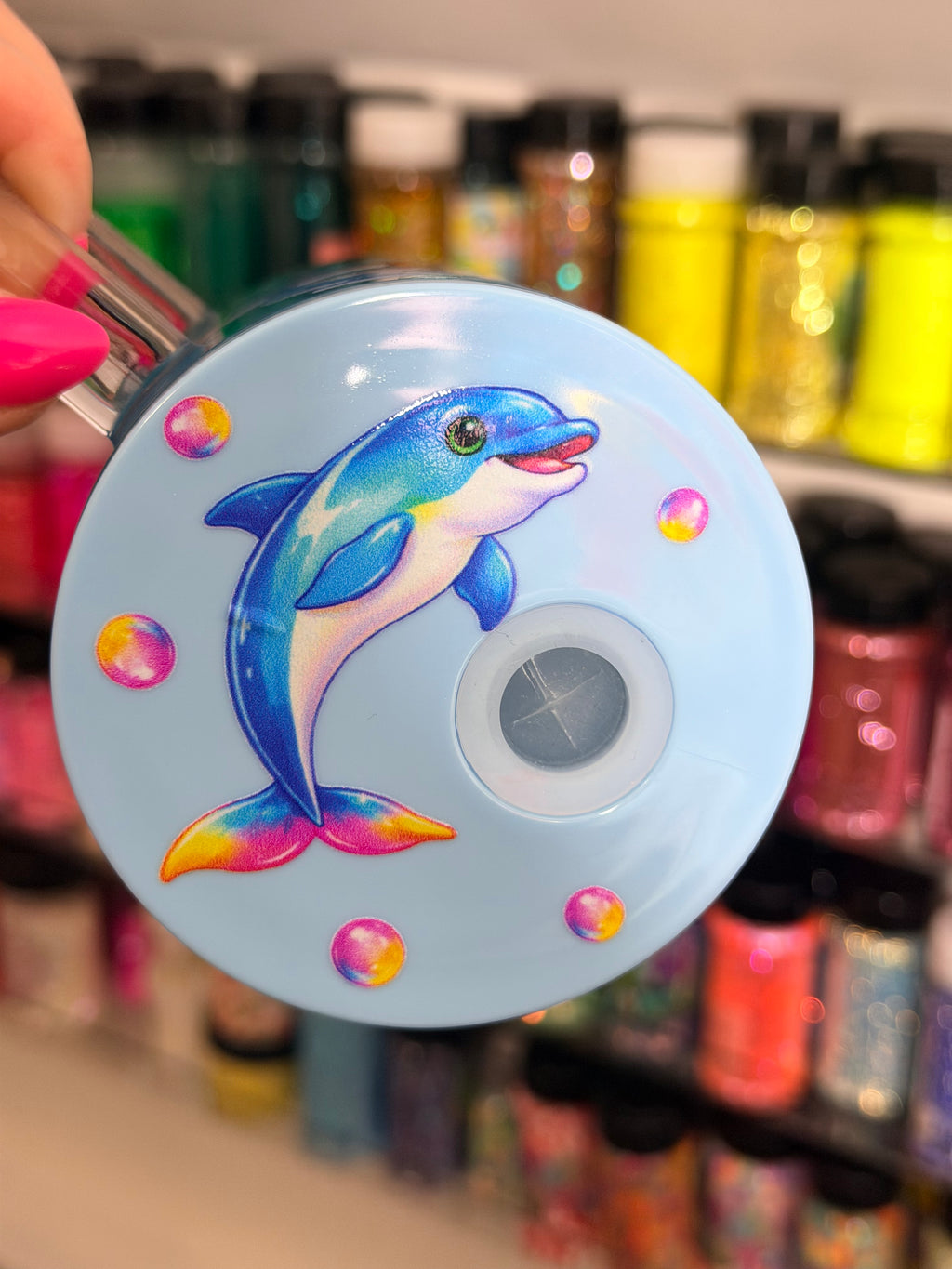 Acrylic coffee mug lid with dolphin decal and bubbles, circular lid design.
