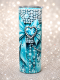 Blue stainless steel tumbler with rhinestone heart, bow, and hanging bead accents