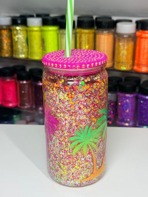 16oz acrylic snow globe tumbler with palm tree glitter, pink lid and green straw