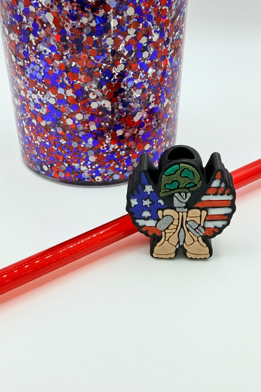 Glitter tumbler cup with red straw and cartoon boot sticker, blue red silver speckles
