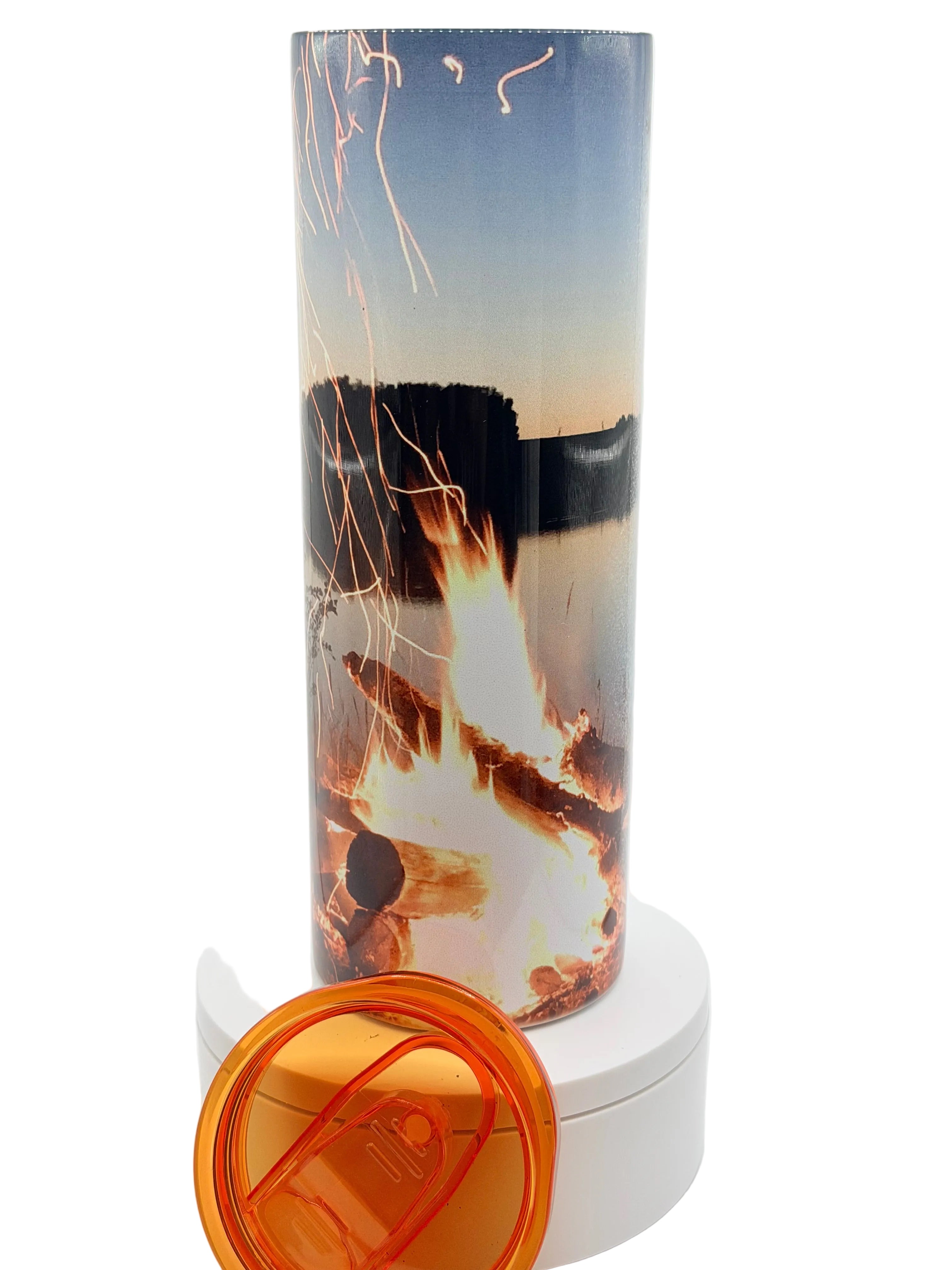 Stainless steel camping cup with blue sunset campfire print and orange flip lid