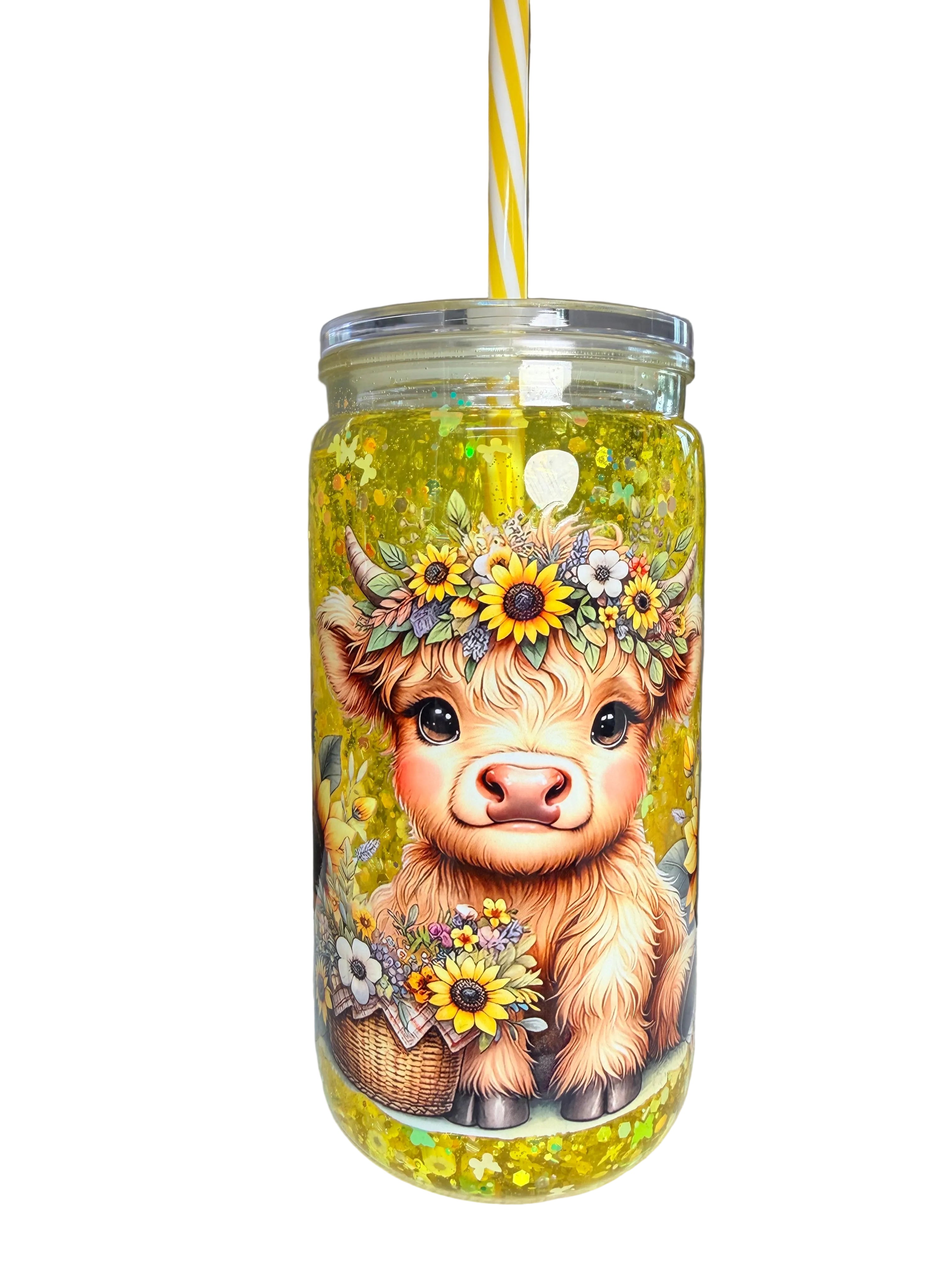 Acrylic snow globe cup with front cow face illustration and yellow glitter; clear lid