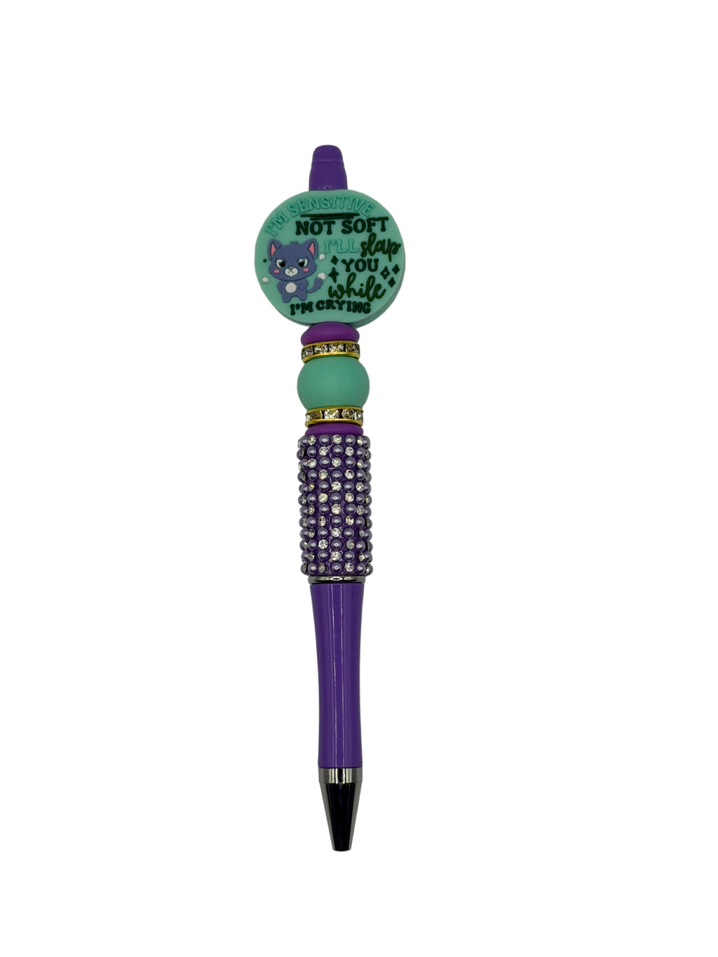 Purple beaded ballpoint pen with teal/green charm cap and purple bead barrel