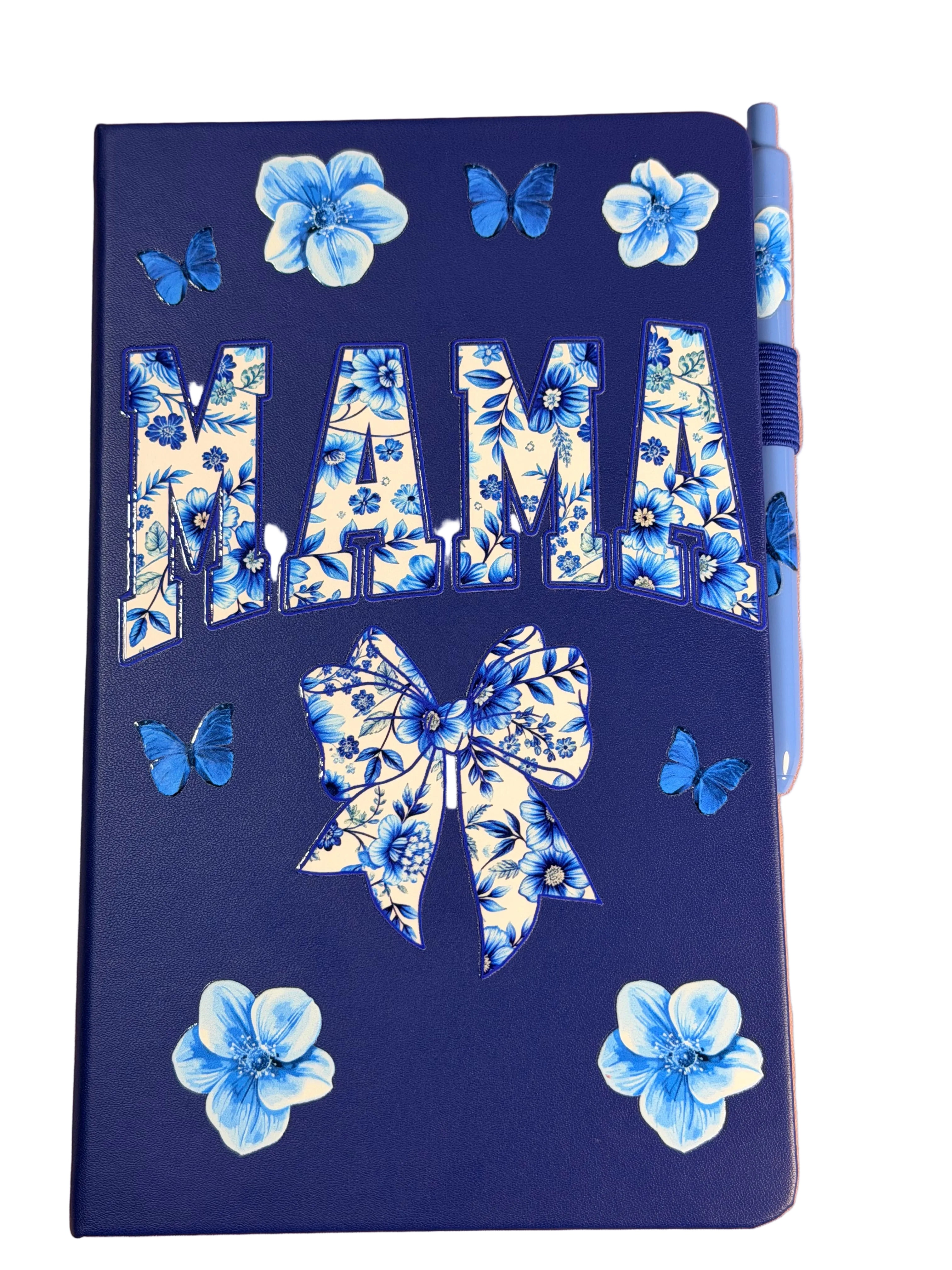 Navy A5 notebook with 'MAMA' floral bow and butterflies; matching blue pen peeking