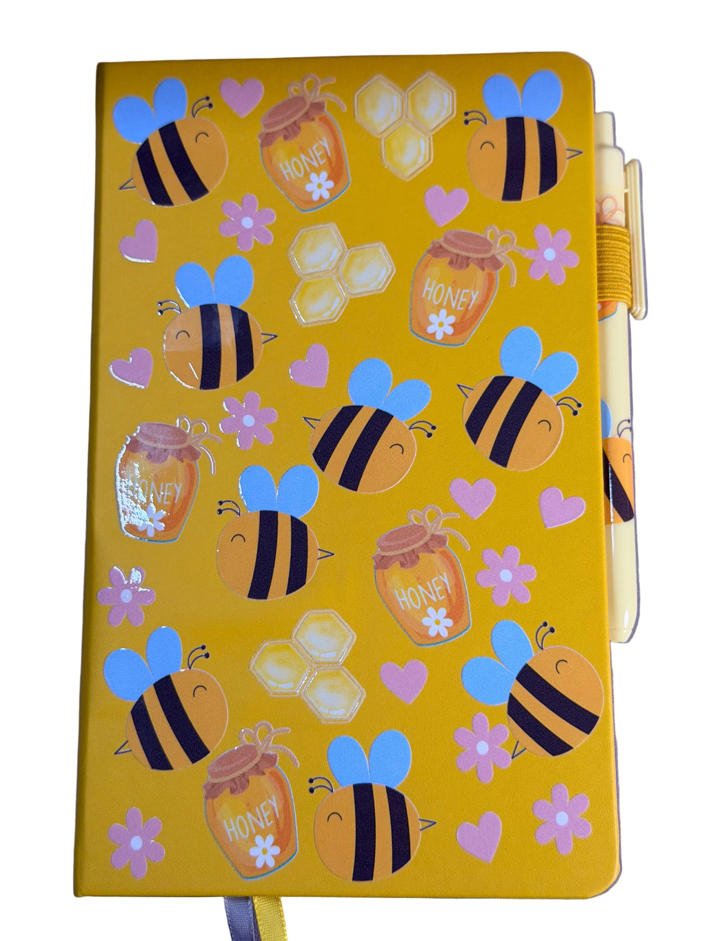 Yellow A5 notebook with bee and honeycomb decals; matching pen tucked at right