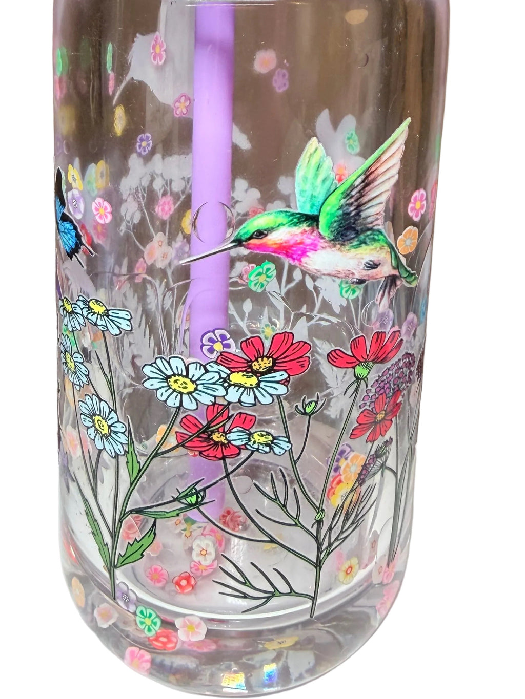Acrylic snow globe tumbler with hummingbird and colorful flowers, purple straw