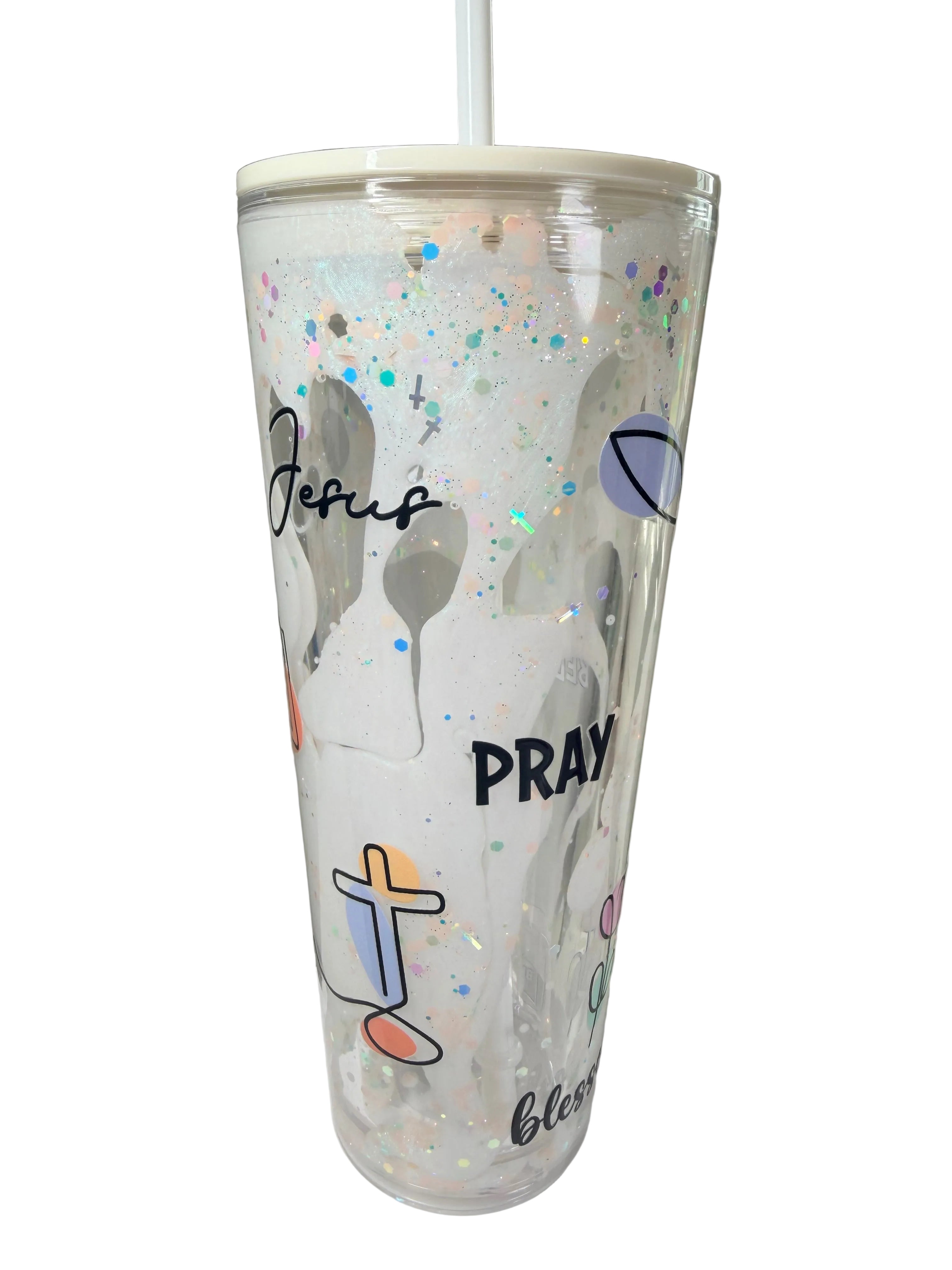 Clear acrylic lava tumbler with glitter speckles, cross decals, and 'Pray' text