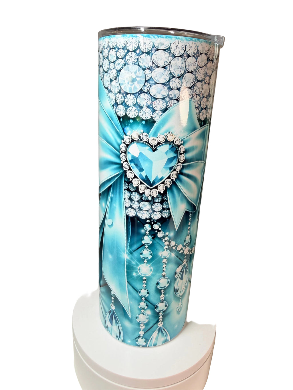 Blue stainless steel tumbler with rhinestone bow and heart; diamond-patterned sides